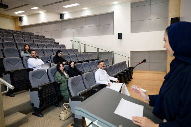 istock Coed group listening to teacher in Riyadh lecture hall 2154284432