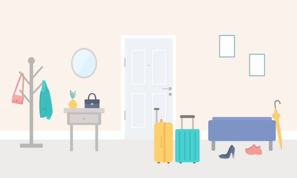 Suitcases By The Door In Corridor. Front Door Entrance To House With Hassock, Coat Hook, Drawer And Luggages. Preparation For Vacation, Leaving Home For Holiday