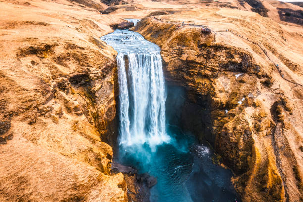 istock Powerful Skogafoss waterfall flowing with dry mountain in autumn at Iceland 2154284969