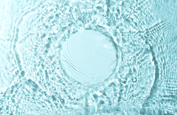 Cosmetic product presentation mockup scene made with empty circle place on water surface made with splashes. Ideal for product placement with an emphasis on freshness and natural purity.