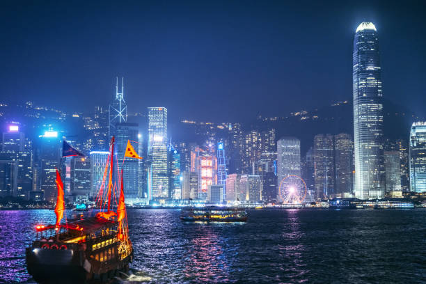 istock Hong Kong Night View with Traditional Junk Boat 2154289793