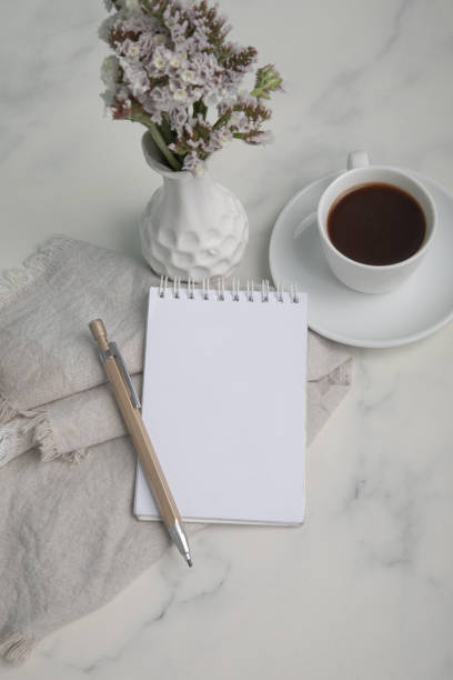 istock Little white Cup of black expresso coffee with little notepad 2154290009
