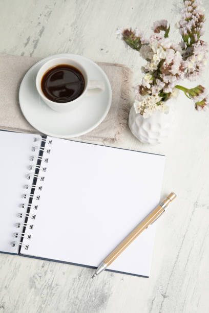 istock Little white Cup of black expresso coffee with little notepad 2154290058