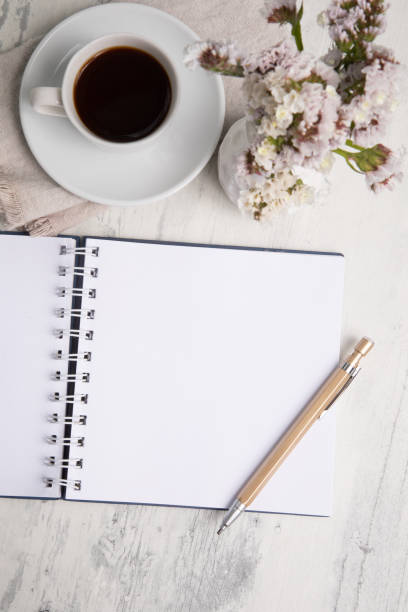 istock Little white Cup of black expresso coffee with little notepad 2154290235