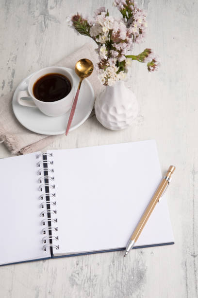 istock Little white Cup of black expresso coffee with little notepad 2154290256