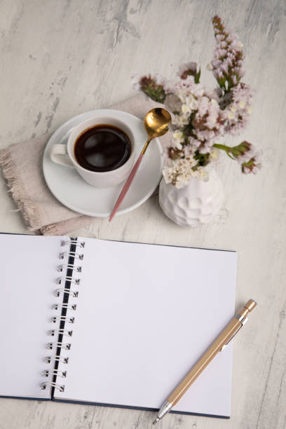 istock Little white Cup of black expresso coffee with little notepad 2154290260