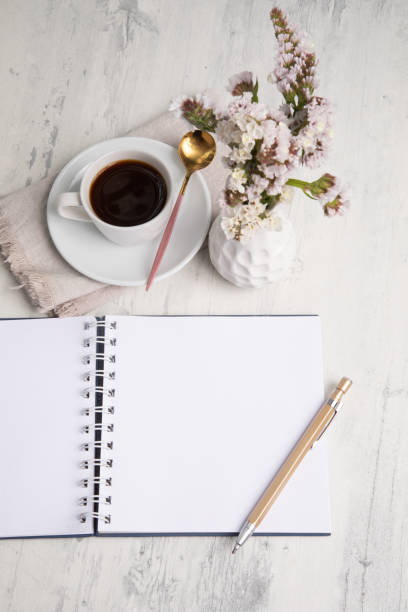 istock Little white Cup of black expresso coffee with little notepad 2154290262