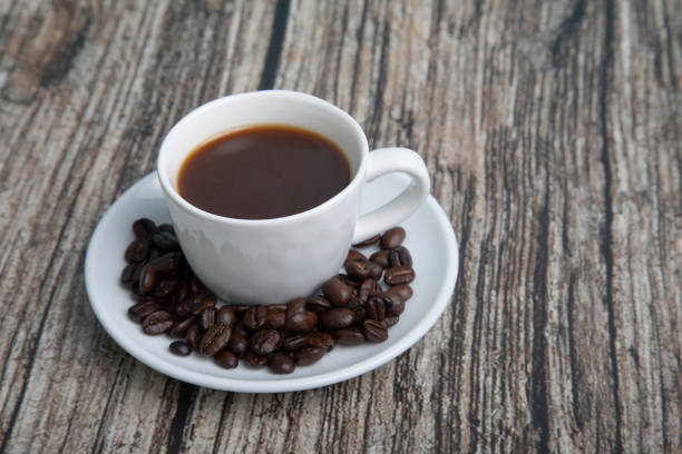 coffee cup in a small cup with small notepad