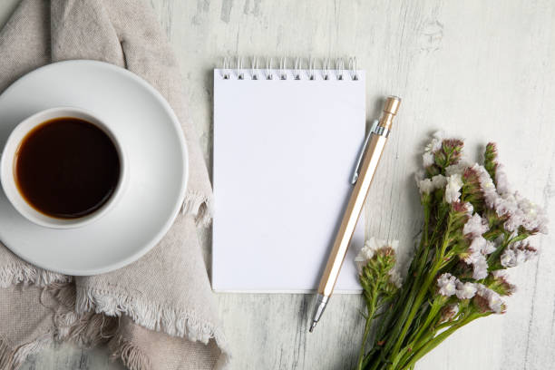 istock Little white Cup of black expresso coffee with little notepad 2154290379
