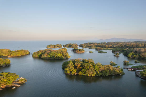 istock Lake coast landscape with mountain volcano background 2154294610