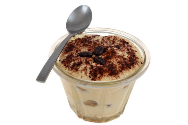 Close-up on parfait with chocolate powder on top served in fine dining