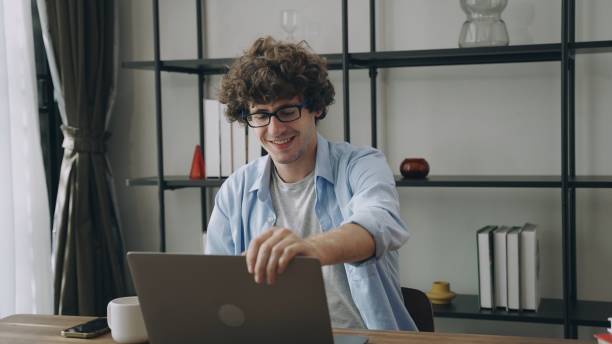 istock Young  businessman or freelance working and use a computer laptop and thinking idea for his business 2154297444