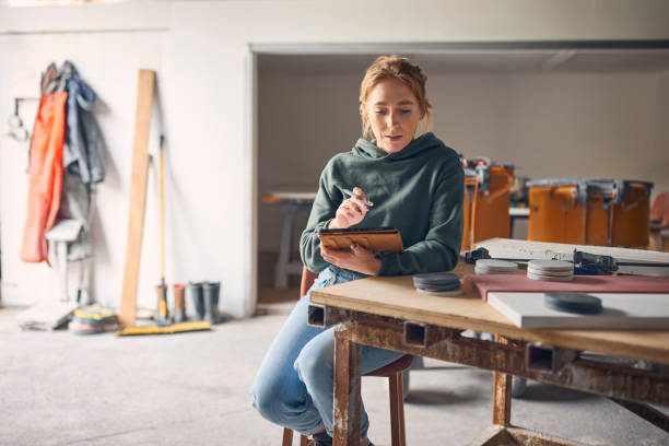 istock Female Worker In Concrete Workshop Using Digital Tablet And Stylus 2154299262