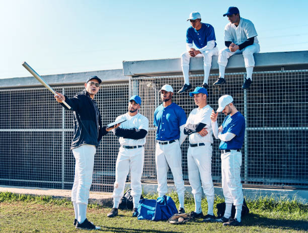 istock Coaching, sports and teamwork with baseball player on field for training, learning and discussion. Solidarity, support and listening with group of people and practice for competition, pitch and goals 2154300560