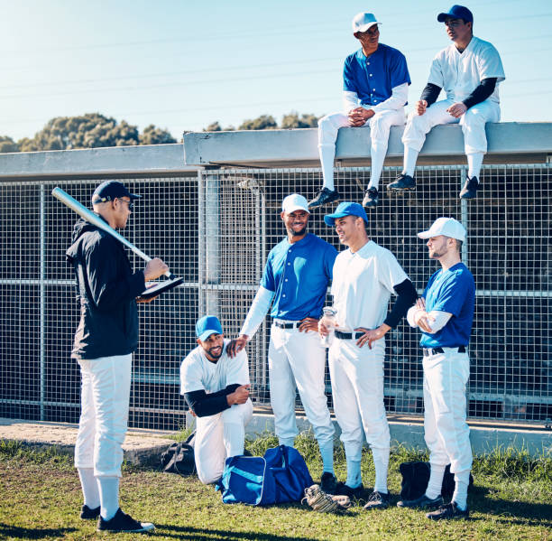 istock Coaching, sports and baseball with men on field for training, learning and discussion. Solidarity, support and listening with group of people and practice for competition, pitch and community 2154300623