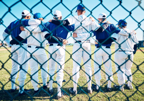istock Baseball, teamwork and back of men on field for competition, training and practice. Solidarity, support and fitness with group of friends playing in park stadium for sports, diversity and league game 2154300657