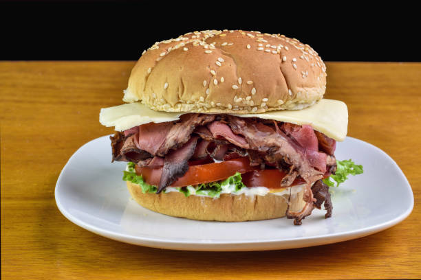 istock roast beef sandwich with  tomatoes and cheese 2154303142