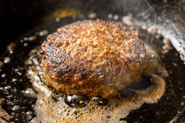 istock hamburger cooked in a frying pan 2154304168
