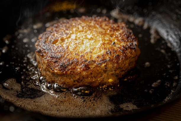 istock hamburger cooked in a frying pan 2154304182