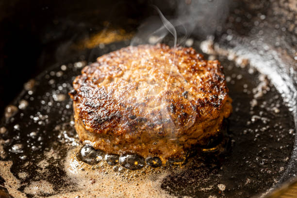 istock hamburger cooked in a frying pan 2154304185