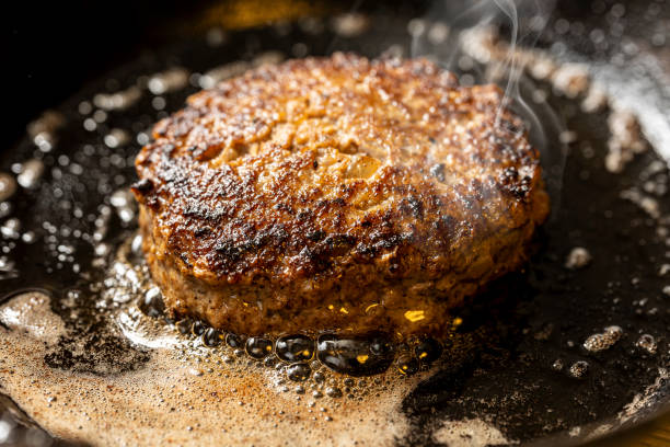 istock hamburger cooked in a frying pan 2154304255