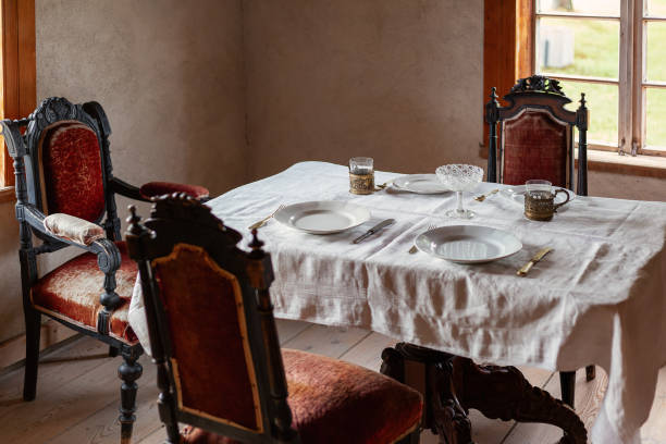 istock Vintage rural dining room with luxury chairs and set table served for lunch 2154310314