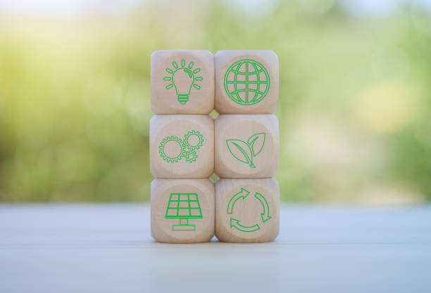 istock environment Earth concept. Net zero greenhouse gas emissions target. Climate neutral long term strategy. wooden cubes with decarbonization icon and green icon. Green banner. 2154310595