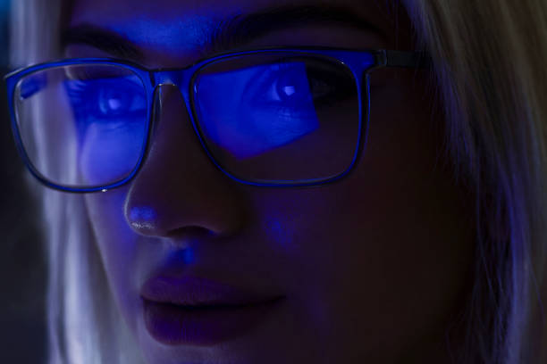 istock Woman working late at night in front of the computer 2154315101