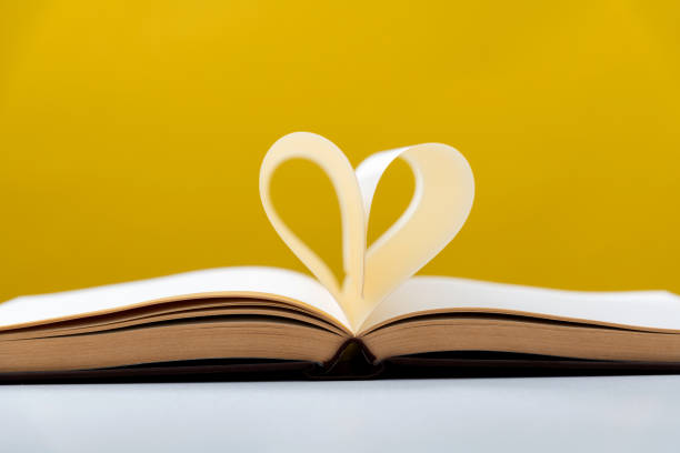 istock Heart shape made of book pages 2154315987