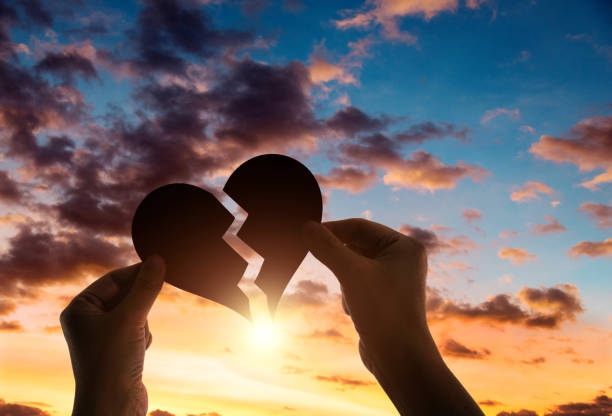 istock Woman hands holding broken heart 2154316118