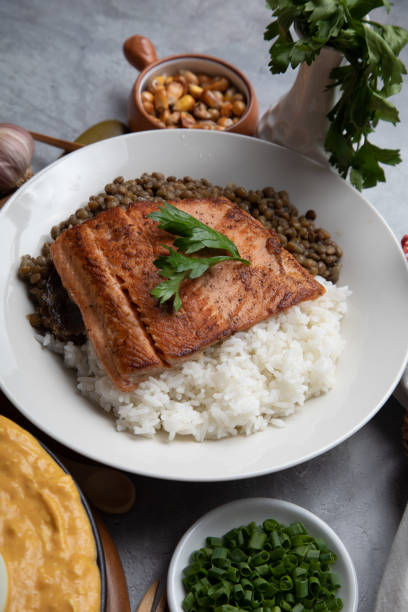 istock Lentils stew with fried fish and white rice monday meal 2154317269