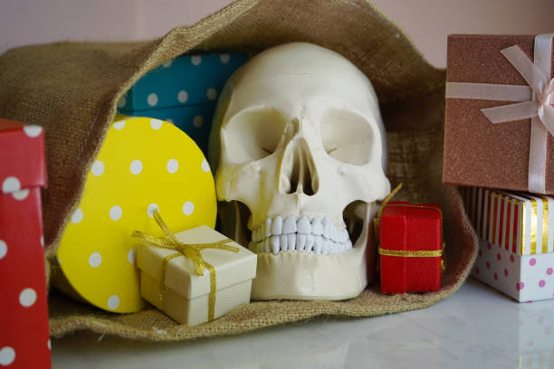 Skull and ghosts on black background with copy space