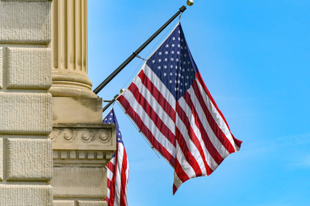 istock Stars and Stripes flag flying from a building 2154318028