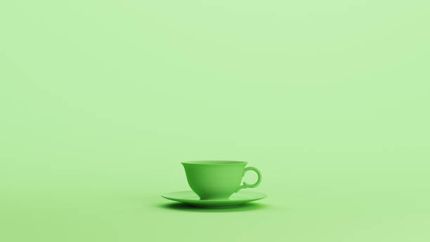 istock Green mint tea cup saucer plate dishware tea cafe pottery soft tones background 2154321182