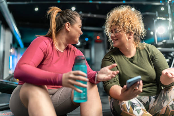 istock Two plus-size women embrace their bodies as they engage in a challenging workout 2154321232