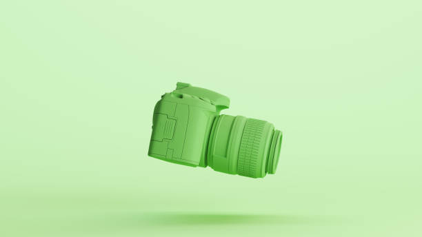 istock Green mint camera dslr digital photography equipment lens optical background side view 2154322129