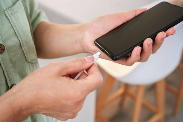istock Plugging USB-c charger cable to a smartphone 2154325017