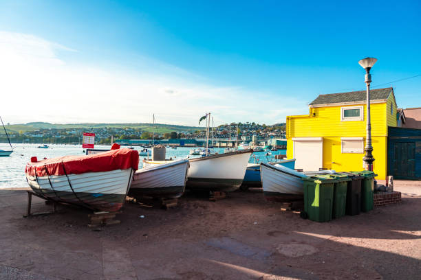 Boats on Teignmouth's beach at sunset