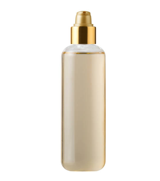 istock perfume ,Foundation cosmetic container, moisturizer bottle on white background golden cap, glass bottle, Skin care products 2154326304