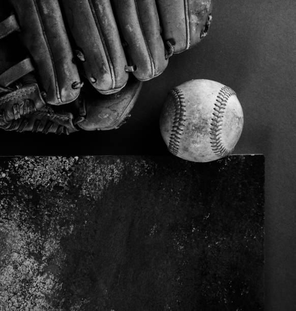 istock Old baseball and glove in black and white 2154327374