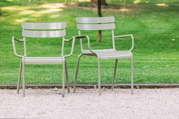 istock Two empty green chairs in the Parisian park 2154327611