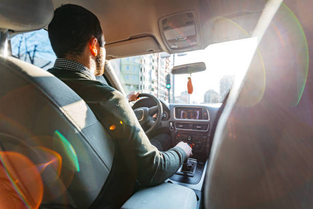 istock Young Man Driving A Car During The Day 2154328118