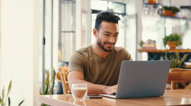 istock Business, man and typing on laptop in cafe with coffee, remote work and copywriting with morning tea. Freelancer, entrepreneur and research planning for blog, online website and writing web review 2154330565