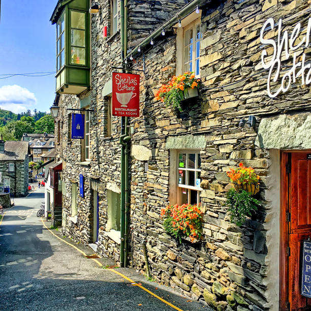View along a narrow street in the centre of Bowness on Windermere, UK.  There are no people in the photograph