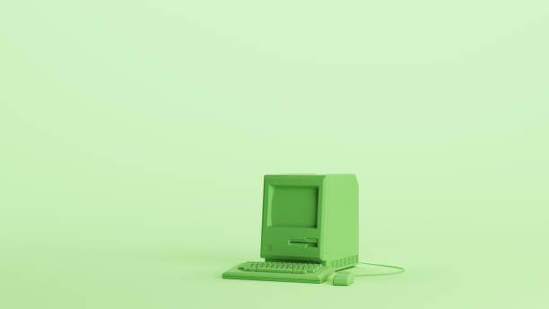 istock Green computer vintage desktop keyboard technology monitor soft tones mint background left view 2154333490