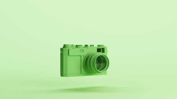 istock Green camera lens retro style nostalgia soft tones mint background 2154333530