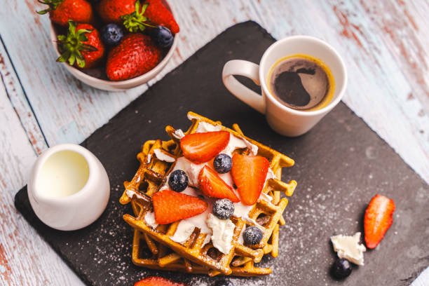 Berry Belgian waffle with raspberries, strawberries and blueberries. Culinary, culinary, bakery concept. Food recipe background. Close-up. High quality photo