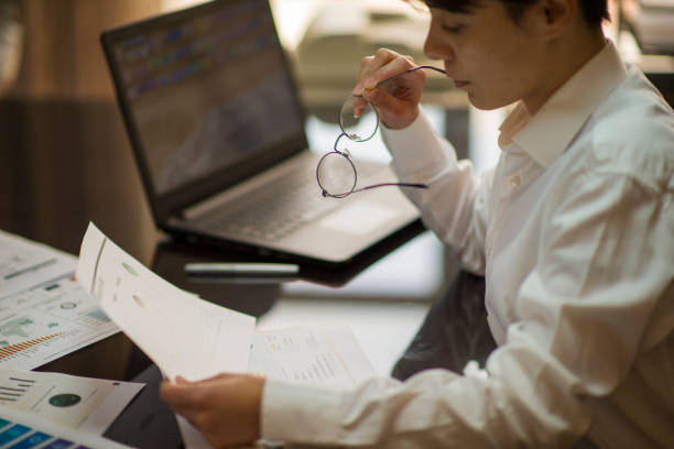 istock Businesswoman working at her desk in an office environment 2154336871