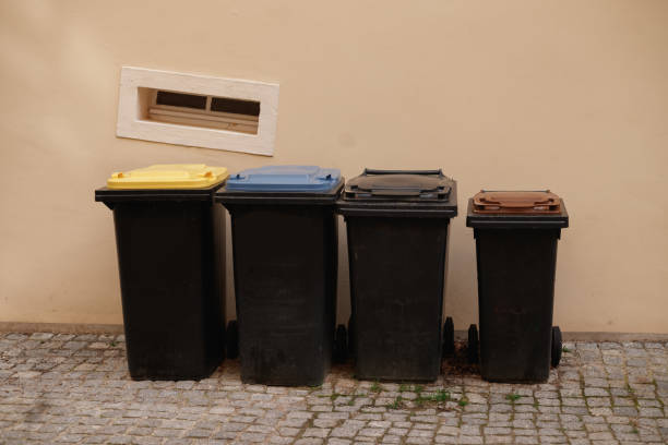istock Different dustbins for waste separation. Recycling in germany. Yellow, blue and brown caps. 2154339882