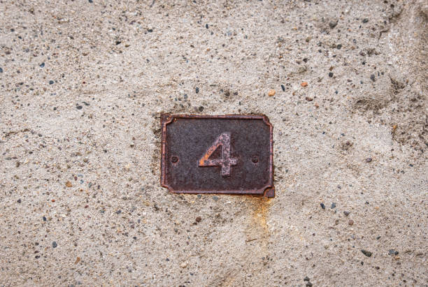 istock House wall with number 4 on rusted metal tin plate. 2154342435